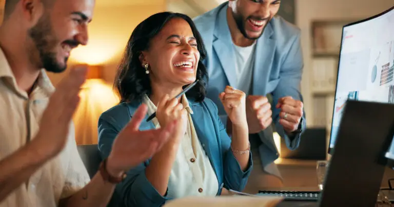 High five, celebration and business people with success, partnership and team building in office. Happy, smile and professional corporate employees celebrate for successful collaboration in workplace.