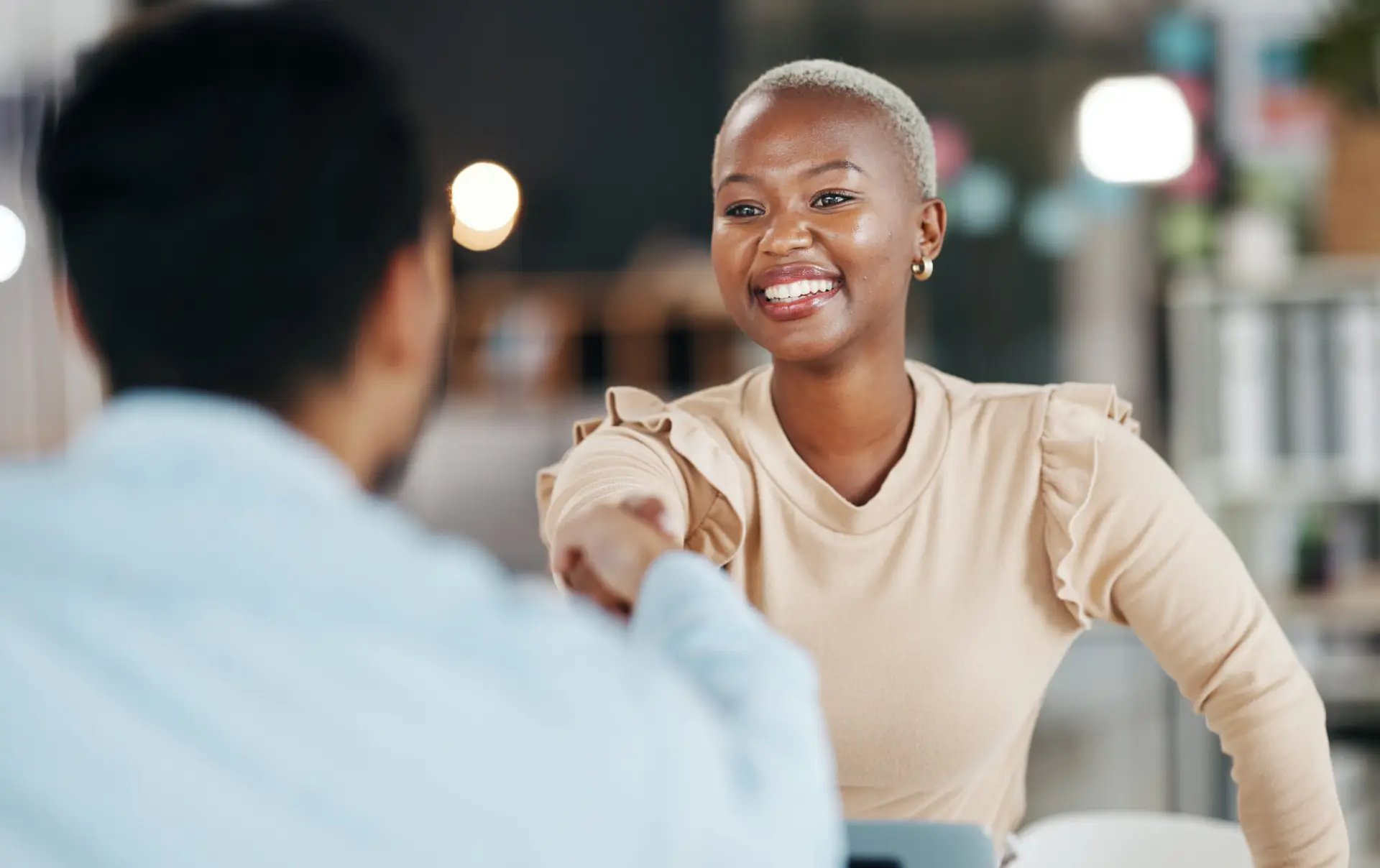 Shaking hands, professional team and smile, partnership and collaboration, agreement or deal with success. Diversity, handshake and people happy working together in meeting with teamwork and trust.