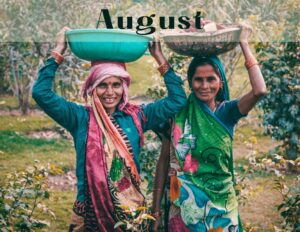 Indigenous women, nature, joyful, baskets in head, colorful